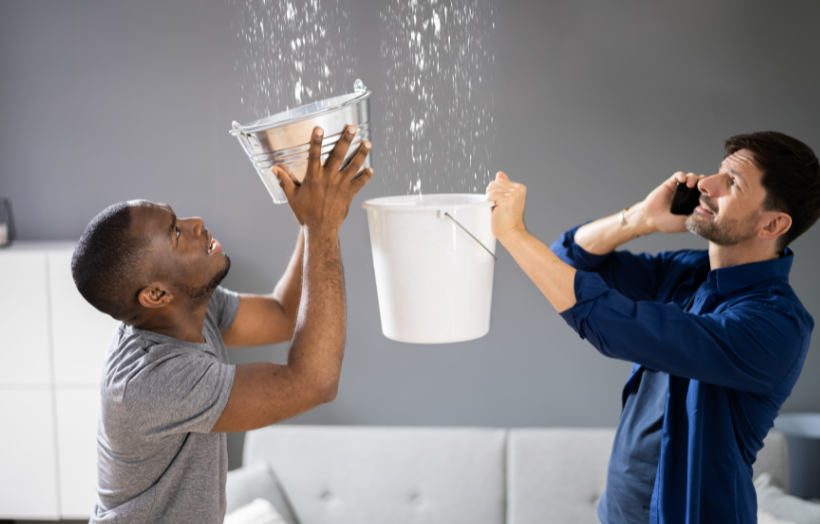 emergency-plumber-fixing-burst-pipe-in-commercial-building-with-tools